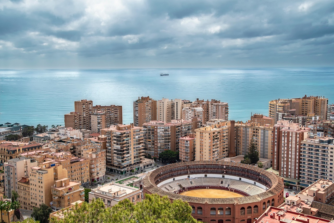 Panoramic view of Málaga with the La Malagueta bullring and the Mediterranean Sea.